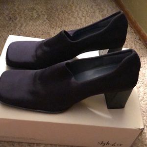 Never worn navy heeled boots.